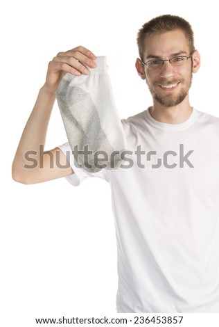 Smiling young white male in his 20s holding a pair of socks isolated on white