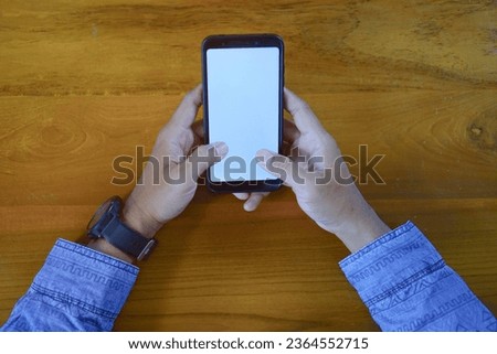Man Touching Smartphone Screen, Sending Messages or Online Shopping Concepts
