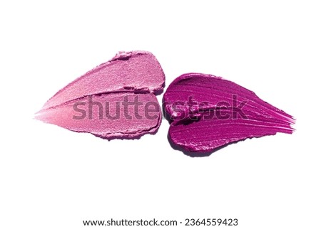 Cosmetic fuchsia purple and pink lip stick smudge kissing lips shape isolated on white  Royalty-Free Stock Photo #2364559423