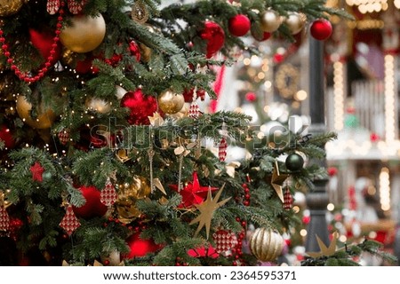 Moscow, Revolution Square. Christmas decoration of the streets. Beautiful festive decorations on the Christmas tree in red and gold traditional colors. New Year's card 2024.