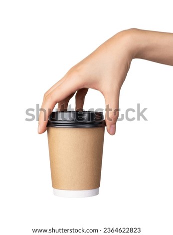 Clipping path, hand holds coffee paper cup on isolated white background.