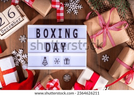 Boxing day sale seasonal promotion background. Various presents gift box with ribbon, with inscription frame Boxing day, block wooden calendar, wrapping holiday paper, Christmas decor, ribbons