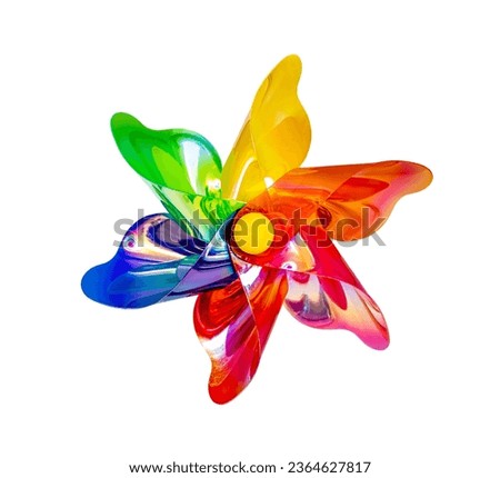 A front view of a regular toy pinwheel windmills with six differently psychedelic colored vanes on white background Royalty-Free Stock Photo #2364627817