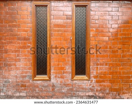 Brown wooden window on brick wall, Window glass and on brick wall Royalty-Free Stock Photo #2364631477
