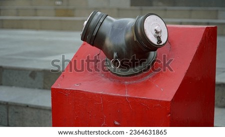 Close-ups of fire hydrants and nozzles from the fire department team for safety and protection, often colored red to be clearly visible in public areas.