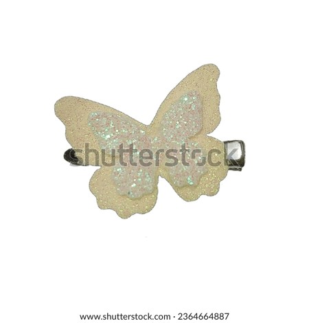 Beautiful yellow butterfly hair clip with glitter against a white background. Royalty-Free Stock Photo #2364664887
