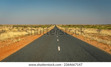 Outback road in Western Australia along the Great Northern Hwy Royalty-Free Stock Photo #2364667147