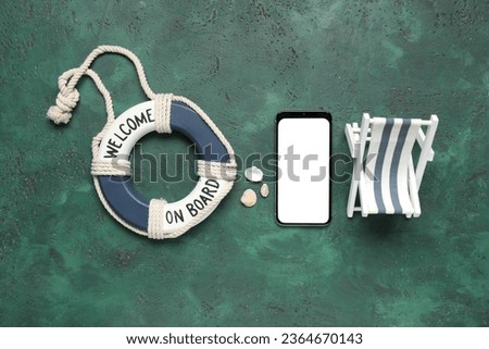 Composition with modern mobile phone and toy beach accessories on color background