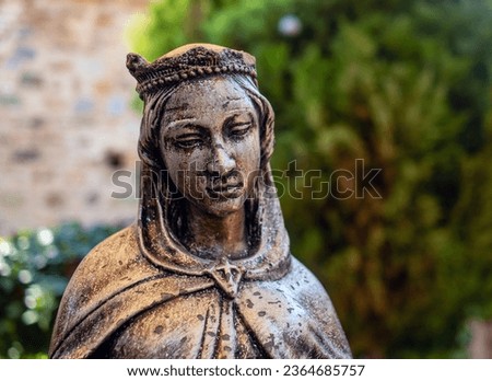 Bronze Virgin Mary statue, close-up. Royalty-Free Stock Photo #2364685757