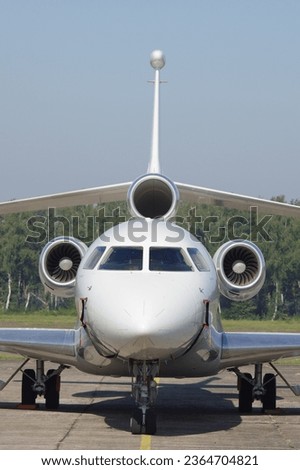 front view modern three-engine business aircraft  private airplane corporate aeroplane