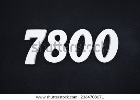 Black for the background. The number 7800 is made of white painted wood.