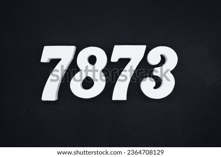 Black for the background. The number 7873 is made of white painted wood.