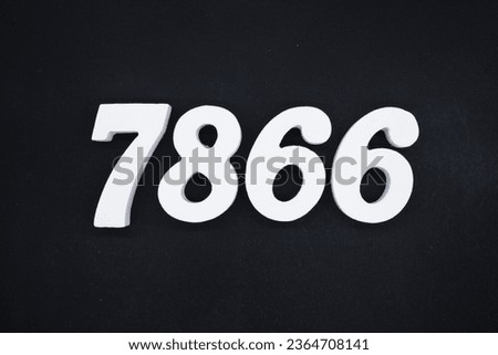 Black for the background. The number 7866 is made of white painted wood.