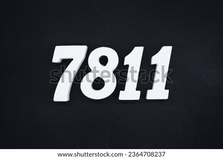 Black for the background. The number 7811 is made of white painted wood.
