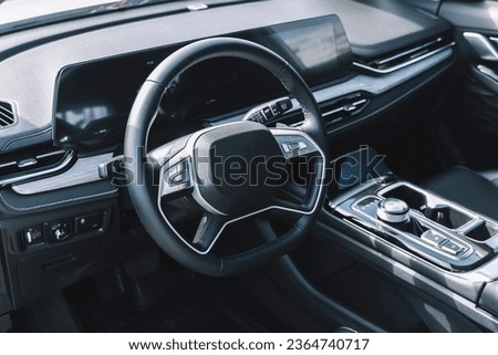 Car interior with auto dashboard panel. New automobile carbon cabin 