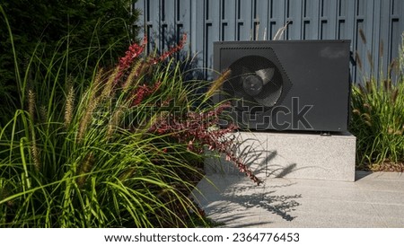 Outdoor heat pump unit for heating a swimming pool. Royalty-Free Stock Photo #2364776453