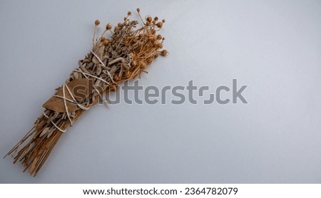 Picture of herbal incense made with herbs such as lavender and sage on a white background