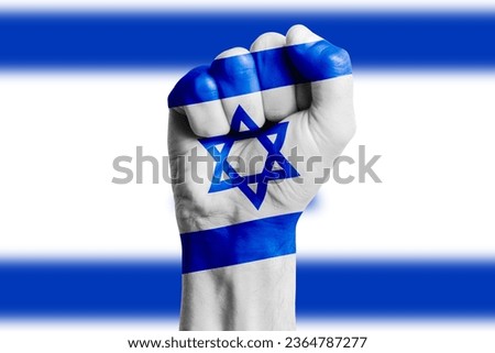 Man hand fist of ISRAEL flag painted. Close-up Royalty-Free Stock Photo #2364787277