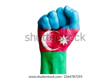 Man hand fist of AZERBAIJAN flag painted. Close-up Royalty-Free Stock Photo #2364787295