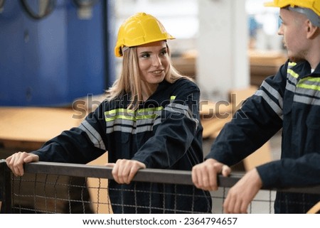 Caucasian engineer man and woman checking hard paper in office at paper factory