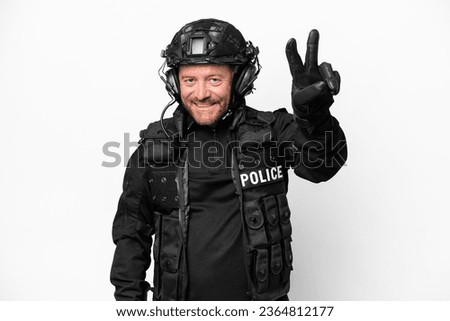 Middle age SWAT man isolated on white background smiling and showing victory sign