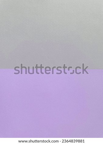 Gray and purple cardboard are folded horizontally in the middle of the frame creating two rectangles, close-up, top view. Design. Texture. Background.