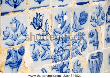 A background of traditional Portuguese antique tiles azulet with drawings of flowers. Portugal.