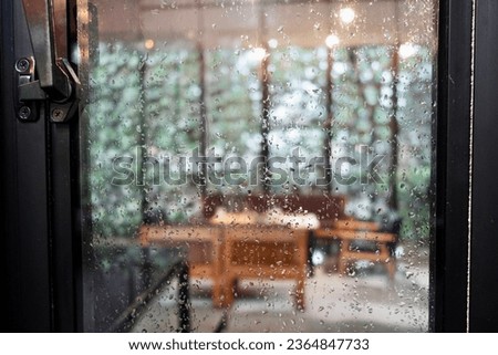 Rain Drops Falling down on background view, High quality photo of Rain on Window Sky Drops, Close up Slow Rain, Rainy day, Heavy Rainfall. Raining at noon.