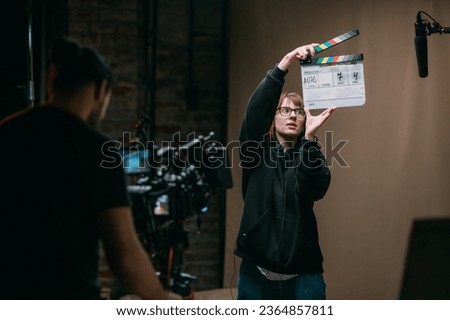Film set, monitors and modern shooting equipment. Film crew, lighting devices, monitors, playbacks - filming equipment and a team of specialists in filming movies, advertising and TV series Royalty-Free Stock Photo #2364857811