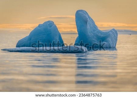 Landscape picture in Svalbard for iceberg in sunset