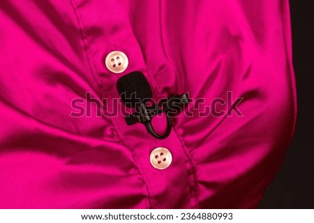 lavalier microphone for voice recording on the shirt. audio device technology. wired small microphone