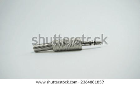Audio signal converters earphone stereo jack type, in the foreground and on white background