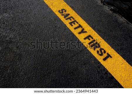 Yellow stripe line with Safety First wording background