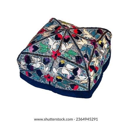 Multicolored Uzbek skullcap with floral pattern.Oriental headdress on a white background. Royalty-Free Stock Photo #2364945291
