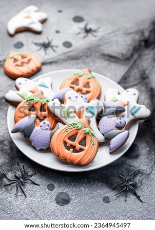 Multicolored Halloween  homemade cookies on dark background.