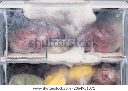 Ice froze in the freezer because the door was not closed. Defrosting the refrigerator. defrosting the freezer. Royalty-Free Stock Photo #2364951071