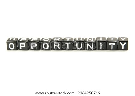 The word Opportunity on the black dice. A favorable juncture of circumstances.