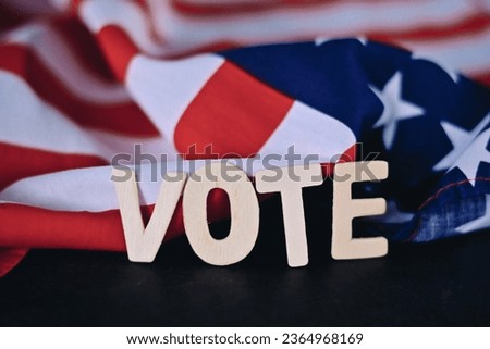 close up vote wooden text with usa flag background, 2024 presidential election wallpaper concept