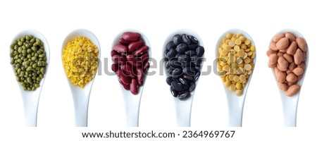 Collection of mix bean (green mung, yellow split bean, red kidney, black bean, yellow split peas, panut) in white spoon isolated on white background with clipping path. Top view. Royalty-Free Stock Photo #2364969767