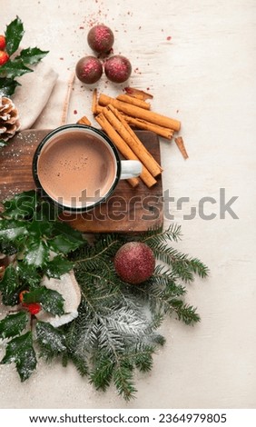 Christmas cacao in white mug  with Christmas decorations on a light background. Merry Christmas greeting card. Top view. Copy space.