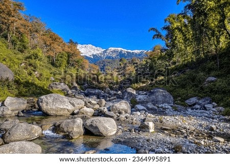 picture of dholadhar mountain range from the small river bed in landscape orientation   Royalty-Free Stock Photo #2364995891