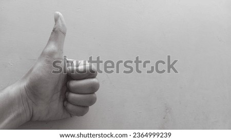 Thumb up for good job, black and white 