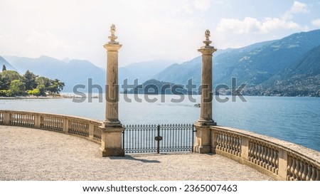 Ornamental gate with roman columns to Como Lake, Italian: Lago di Como, Bellagio, Lombardy, Italy