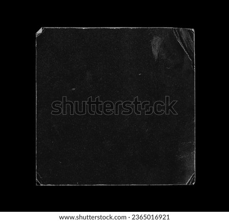 Old Black Square Empty Aged Damaged Paper Cardboard Photo Card Isolated on Black.  Folded Edges. Square CD Vinyl Cover Package Envelope. Rough Grunge Shabby Scratched Torn Ripped Texture.  Royalty-Free Stock Photo #2365016921
