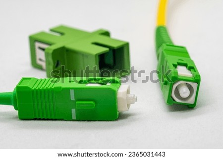 Single-mode optical patch cords with SC-APC connectors, beveled end visible at the connector, close-up Royalty-Free Stock Photo #2365031443