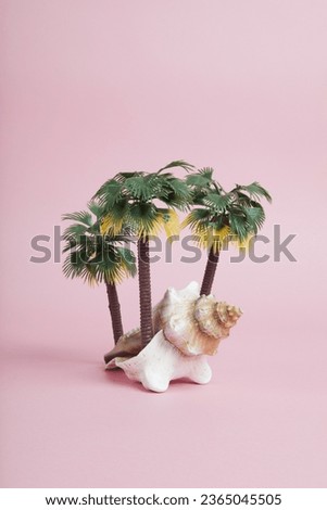 A conch shell used as a metaphor for a tropical island. Offbeat and poetic symbolism composition on a pastel pink background. Minimal colors still life photography.