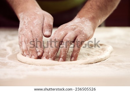 hands knead the dough ( Bot Mi ) for pizza making