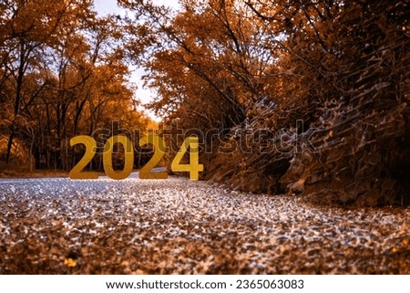 Happy New Year 2024 is coming concept. New year idea with 2024 text on forest road. Photo image can be used as large display, print, website banner, social media post.