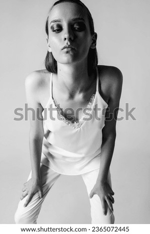 Fashion woman model editorial posing in the studio Royalty-Free Stock Photo #2365072445