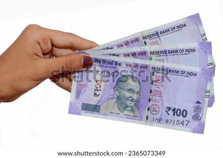 Lady Hand Hold Indian New Currency 100 Rupees Note. Giving money to another person One Hundred Rupees Note. Royalty-Free Stock Photo #2365073349